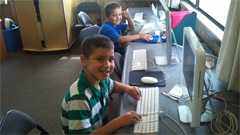 Boys working at computers.